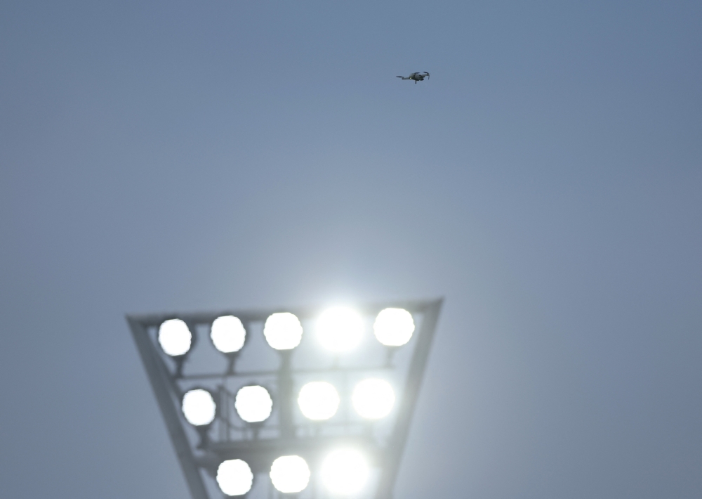 A drone is seen above the stadium during the match as play is stopped REUTERS/Hannah Mckay