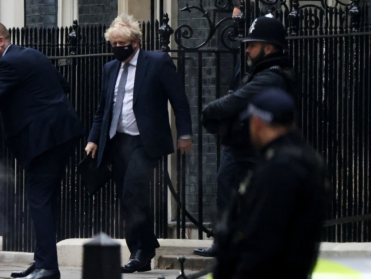 British Prime Minister Boris Johnson walks outside Downing Street in London, Britain, January 25, 2022. REUTERS/Henry Nicholls
