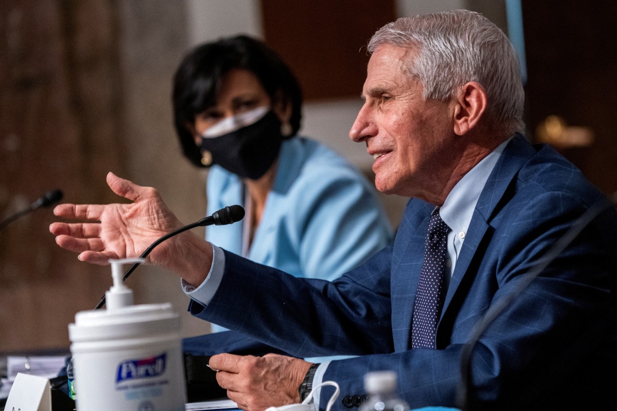 FILE PHOTO: Dr. Anthony Fauci, director of the National Institute of Allergy and Infectious Diseases, testifies during a Senate Health, Education, Labor, and Pensions Committee hearing to examine the federal response to the coronavirus disease (COVID-19) and new emerging variants at Capitol Hill in Washington, D.C., U.S. January 11, 2022. Shawn Thew/Pool via REUTERS/File Photo
