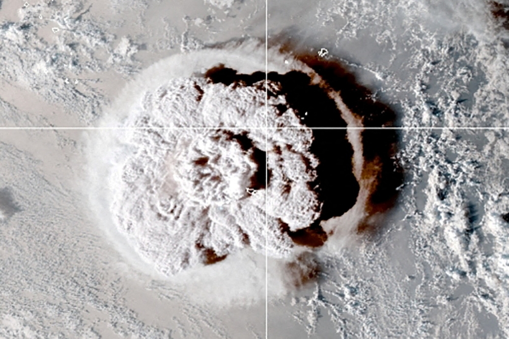 The eruption of an underwater volcano off Tonga, which triggered a tsunami warning for several South Pacific island nations, is seen in an image from the NOAA GOES-West satellite taken at 05:00 GMT January 15, 2022. CIRA/NOAA/Handout via REUTERS/