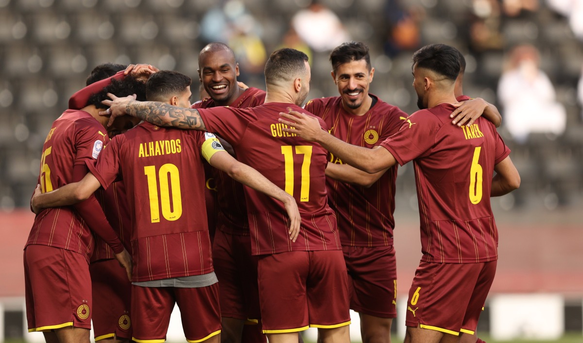 Al Sadd players celebrate after defeating Al Gharada 5-1 yesterday.