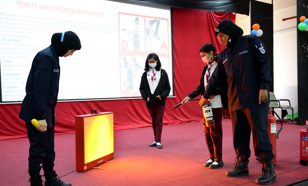 Civil Defence officials with students of MES Indian School.