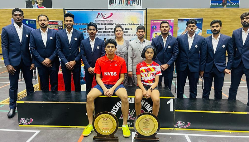 Sponsorship winners Nishant Devendraraj Shenai and Mayukha Sreejesh pose for a photo with the NVBS coaches. 