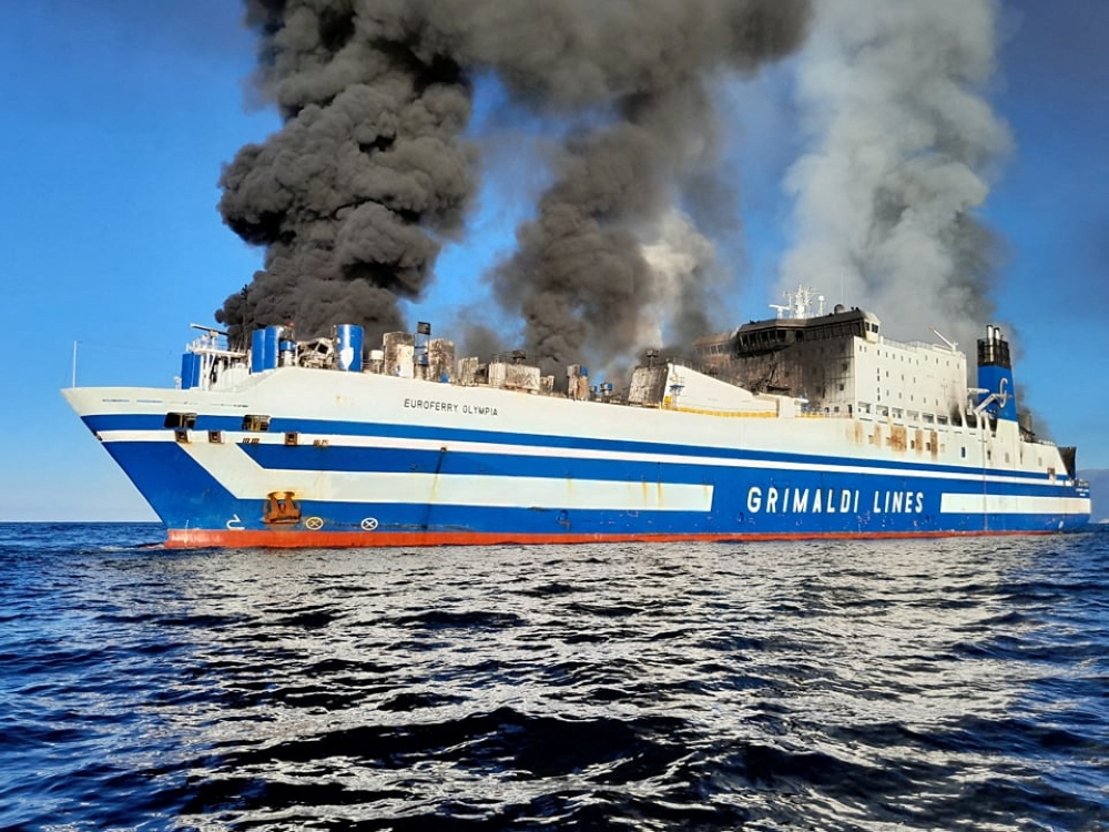 Smoke rises from the Italian-flagged Grimaldi Euroferry Olympia that caught fire off the coast of Corfu island, Greece, February 18, 2022, in this picture obtained from social media. Nikos Bardis ? debater.gr/via REUTERS