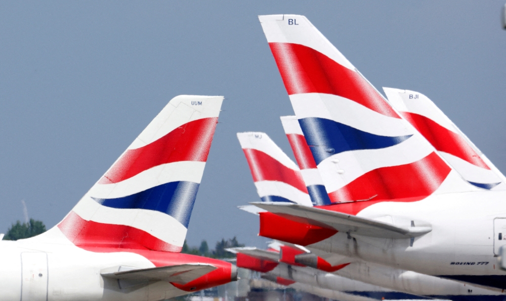 British Airways tail fins are pictured at Heathrow Airport in London, Britain, May 17, 2021. Reuters/John Sibley/File Photo