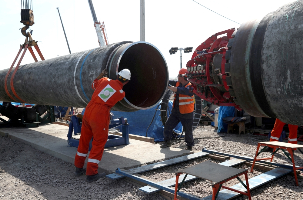 FILE PHOTO: Workers are seen at the construction site of the Nord Stream 2 gas pipeline, near the town of Kingisepp, Leningrad region, Russia, June 5, 2019. REUTERS/Anton Vaganov