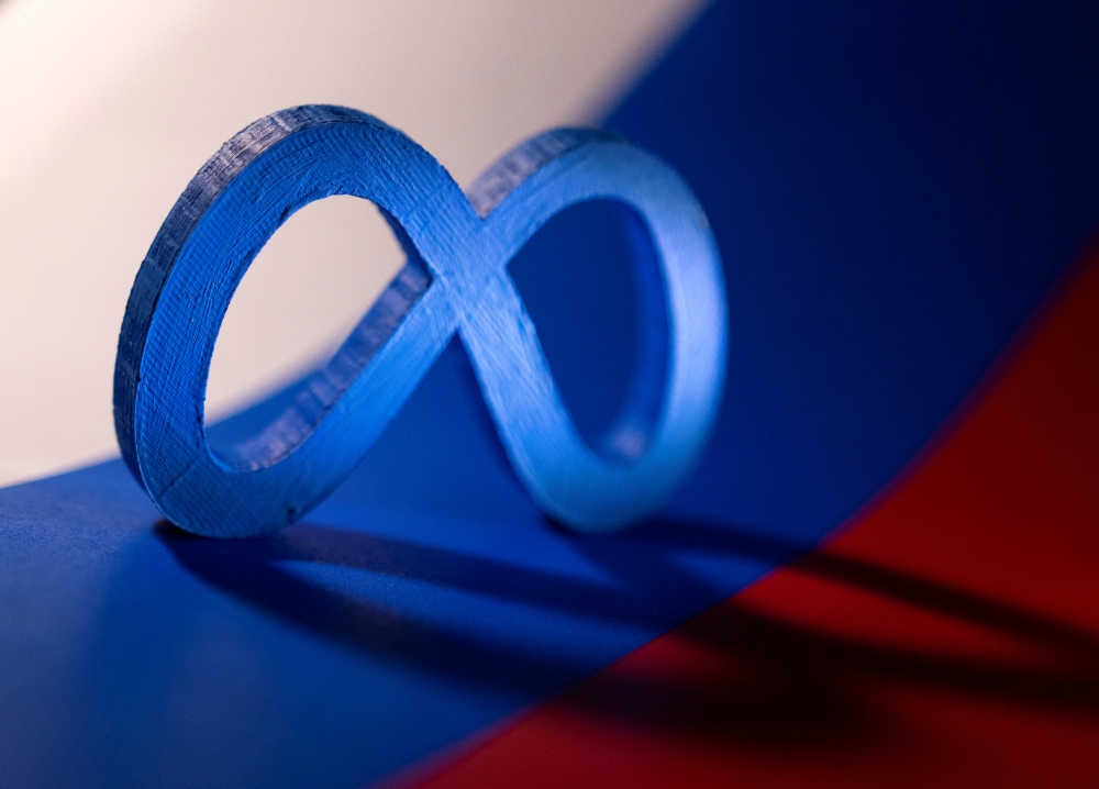 Meta logo is placed on a Russian flag in this illustration taken February 26, 2022. Reuters/Dado Ruvic/Illustration