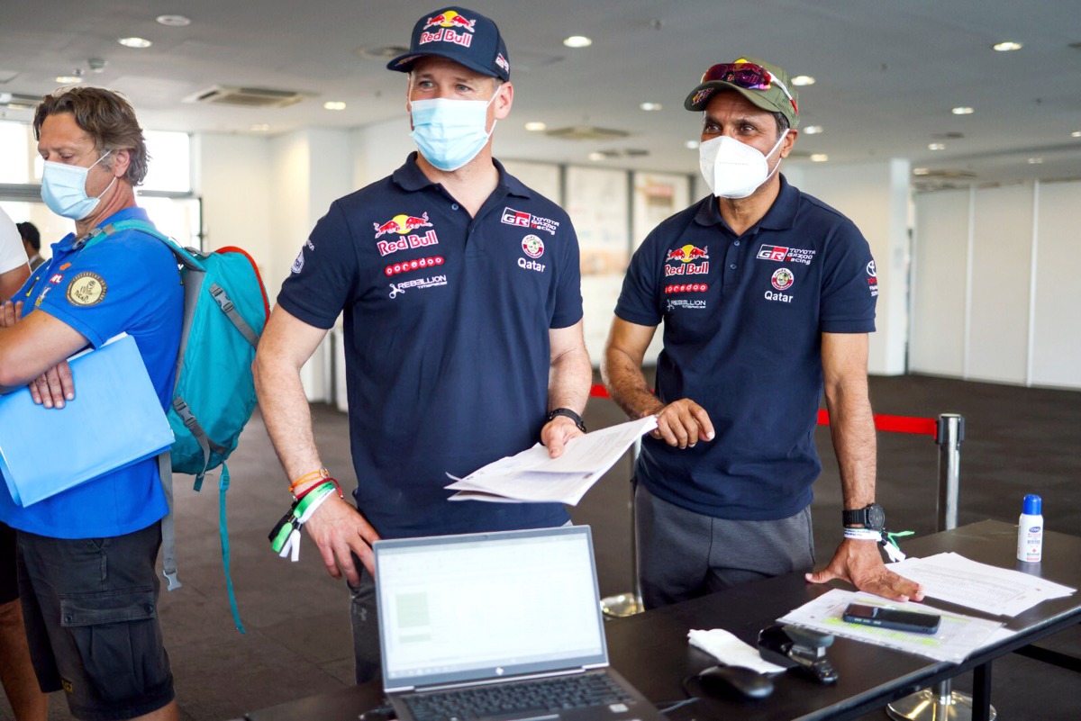 Qatar’s Nasser Saleh Al Attiyah and his French navigator Mathieu Baumel during yesterday's technical inspection.