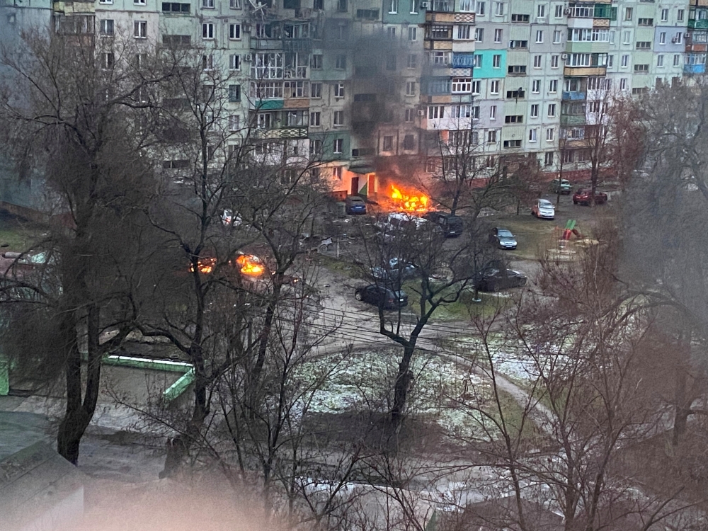 Fire is seen in Mariupol at a residential area after shelling amid Russia's invasion of Ukraine on March 3, 2022, in this image obtained from social media. (Twitter @AyBurlachenko via REUTERS)
