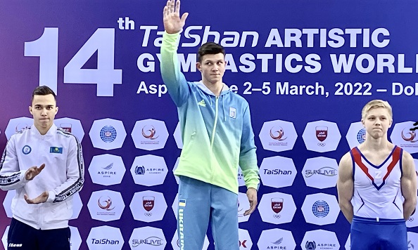 Illia Kovtun celebrates on the podium.