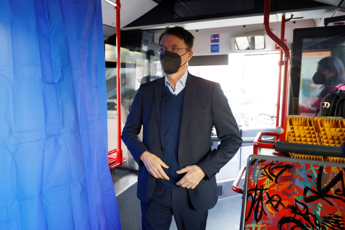 German Federal Health Minister Karl Lauterbach arrives in the #ImpfenHilft tour bus at the project's launch in Berlin, Germany March 10, 2022. Michele Tantussi/Pool via REUTERS
