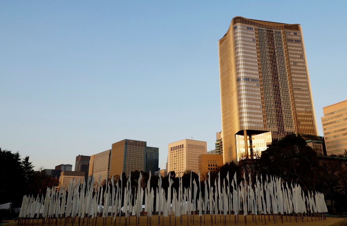 White flags are placed at a park to mourn the victims of the March 11, 2011 earthquake and tsunami, one day before the 11th anniversary of the events that killed thousands and set off a nuclear crisis, in Tokyo, Japan, March 10, 2022. REUTERS/Kim Kyung-Hoon
