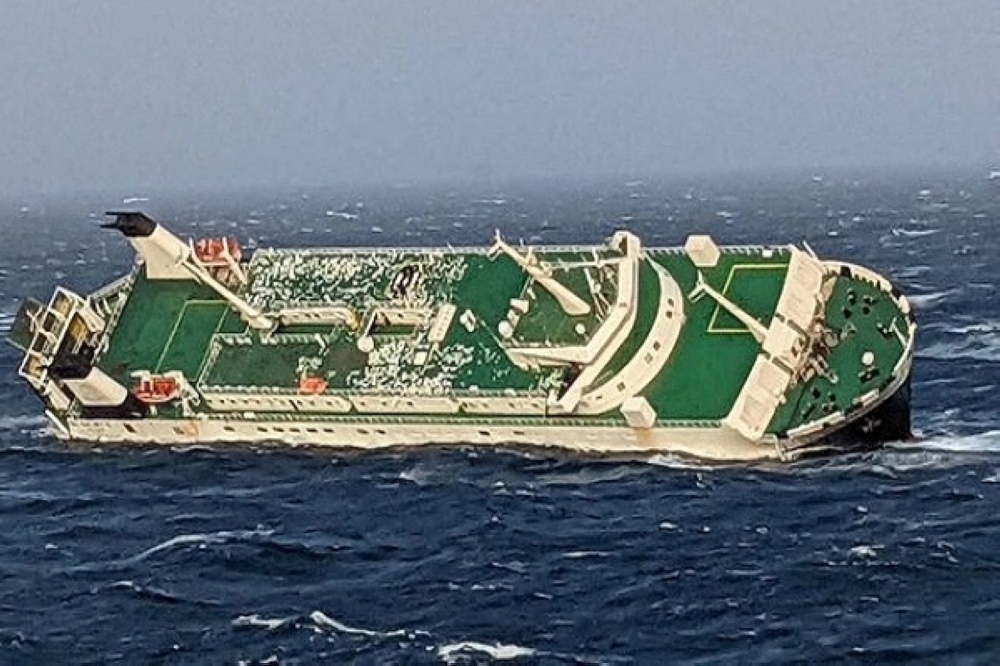 An Emirati ship is seen sinking 30 miles from Assaluyeh in the Arabian Gulf, Iran, March 17, 2022. Iran Ports organization/WANA /Handout via Reuters
 