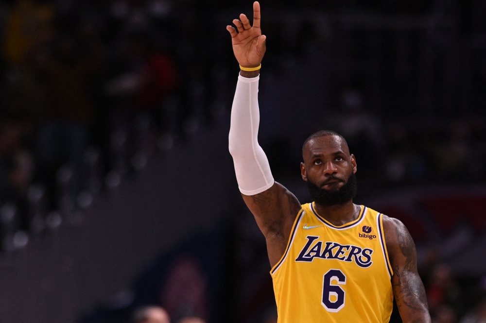 Los Angeles Lakers forward LeBron James (6) waves to the crowed after becoming the second all time scoreing list NBA history during the second quarter against the Washington Wizards at Capital One Arena. Mandatory Credit: Tommy Gilligan-USA TODAY Sports