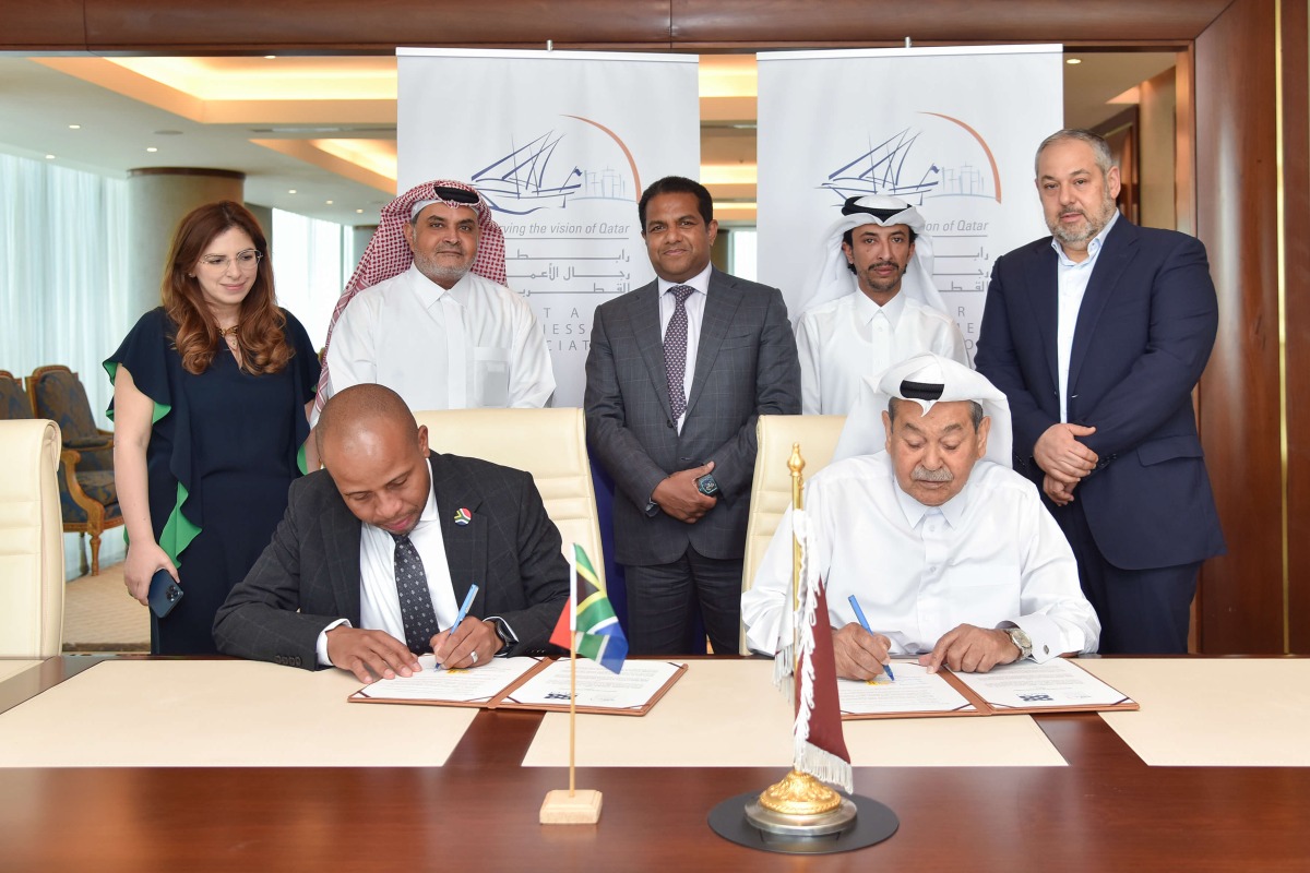 Members of QBA and South African Chamber of Commerce & Industry during the agreement signing ceremony.