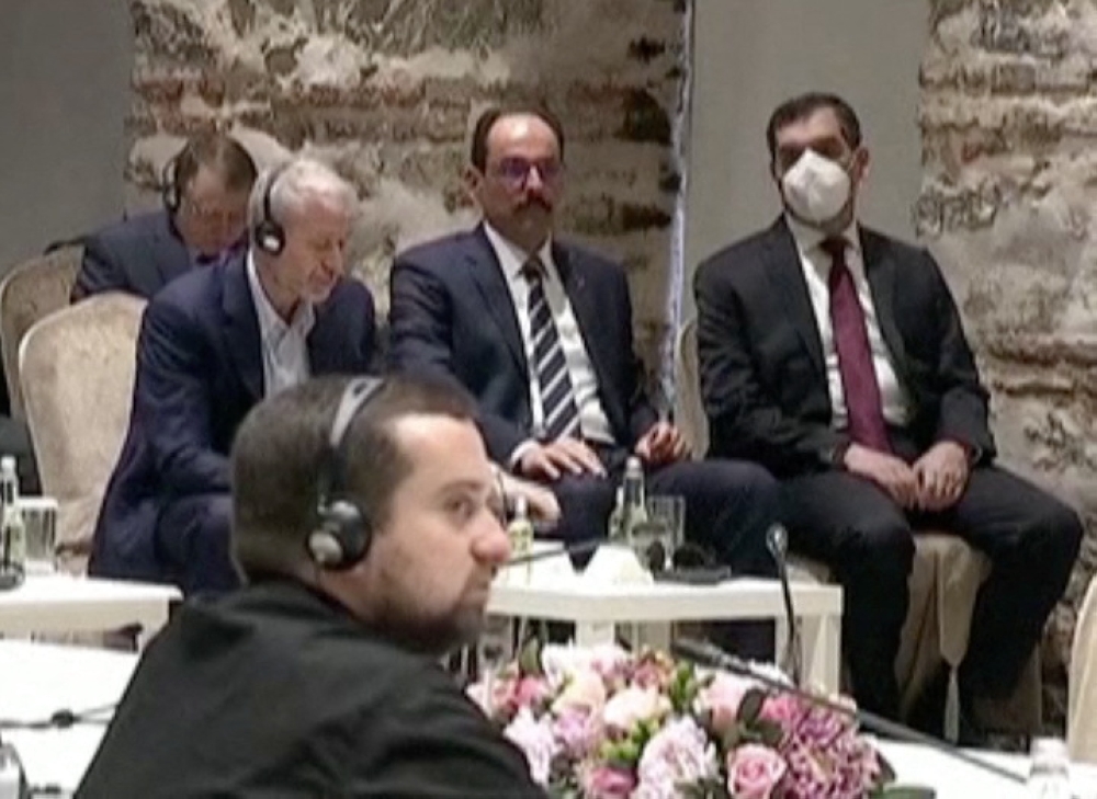 Russian billionaire Roman Abramovich listens as Turkish President Tayyip Erdogan (not seen) addresses Russian and Ukrainian negotiators before their face-to-face talks in Istanbul, Turkey March 29, 2022 in this screen grab taken from a video.