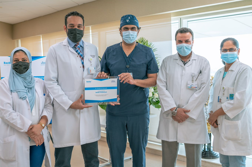 Dr. Khalid Al Rumaihi (centre) is being honoured as one of the pioneers in the use of Rezum treatment for patients with an enlarged prostate.