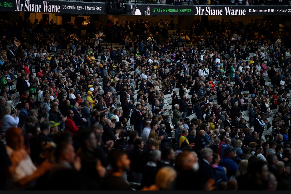People attend the State Memorial Service for cricket legend Shane Warne at the Melbourne Cricket Ground (MCG) in Melbourne, Australia, March 30, 2022. AAP Image/Joel Carrett via REUTERS
