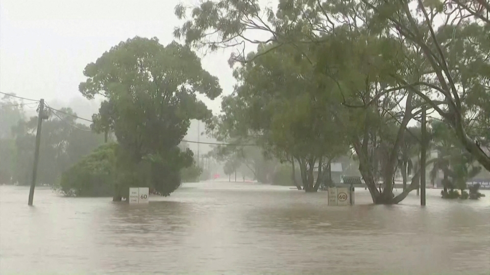 A view shows a flooded street following heavy rains in the northern town of Lismore, New South Wales, Australia March 30, 2022 in this still image taken from a video. Seven Network/Handout via REUTERS