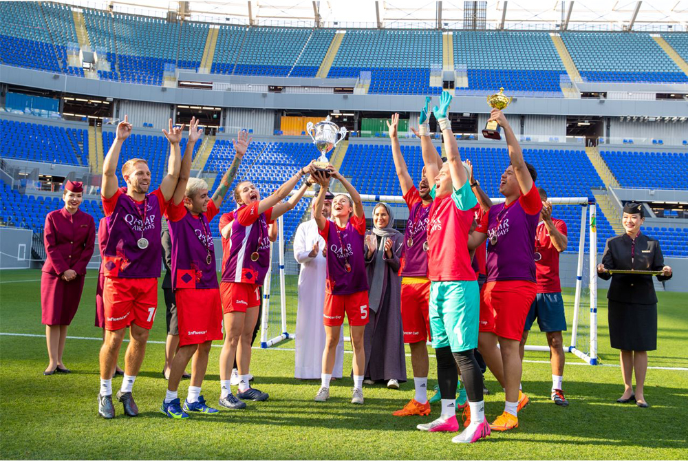 The winners celebrating with their trophies.