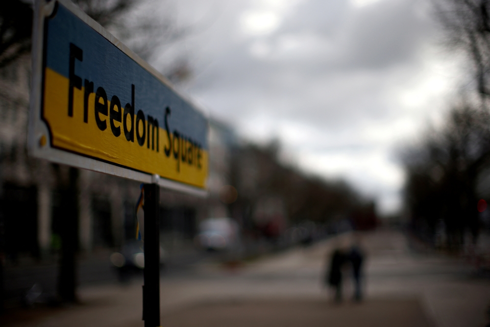 A sign reading 'Freedom Square' in the national colours of Ukraine is set up near the Russian embassy, as Russia's invasion of Ukraine continues, in Berlin, Germany, April 5, 2022. Reuters/Lisi Niesner