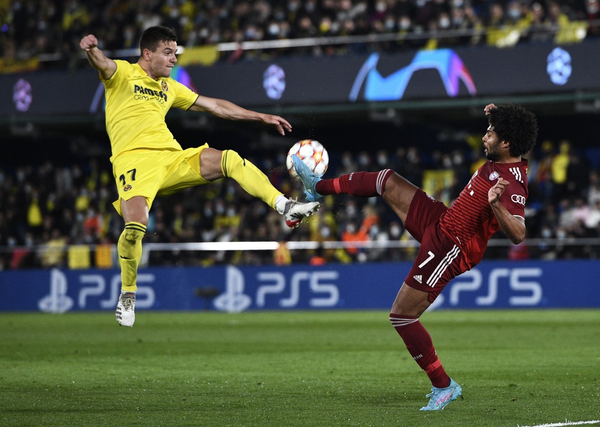 Villarreal's Giovani Lo Celso in action with Bayern Munich's Serge Gnabry REUTERS/Pablo Morano
