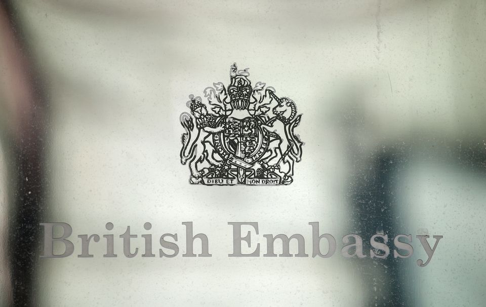 A view shows a sign hanging on the facade of the British Embassy in Kyiv, Ukraine February 13, 2022. REUTERS/Valentyn Ogirenko

