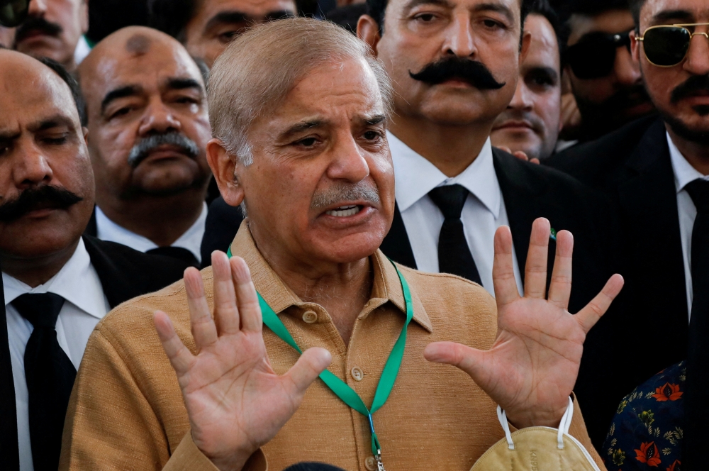 Leader of the opposition Mian Muhammad Shehbaz Sherif, brother of ex-Prime Minister Nawaz Sharif, gestures as he speaks to the media at the Supreme Court of Pakistan in Islamabad, Pakistan April 7, 2022. REUTERS/Akhtar Soomro/File Photo
