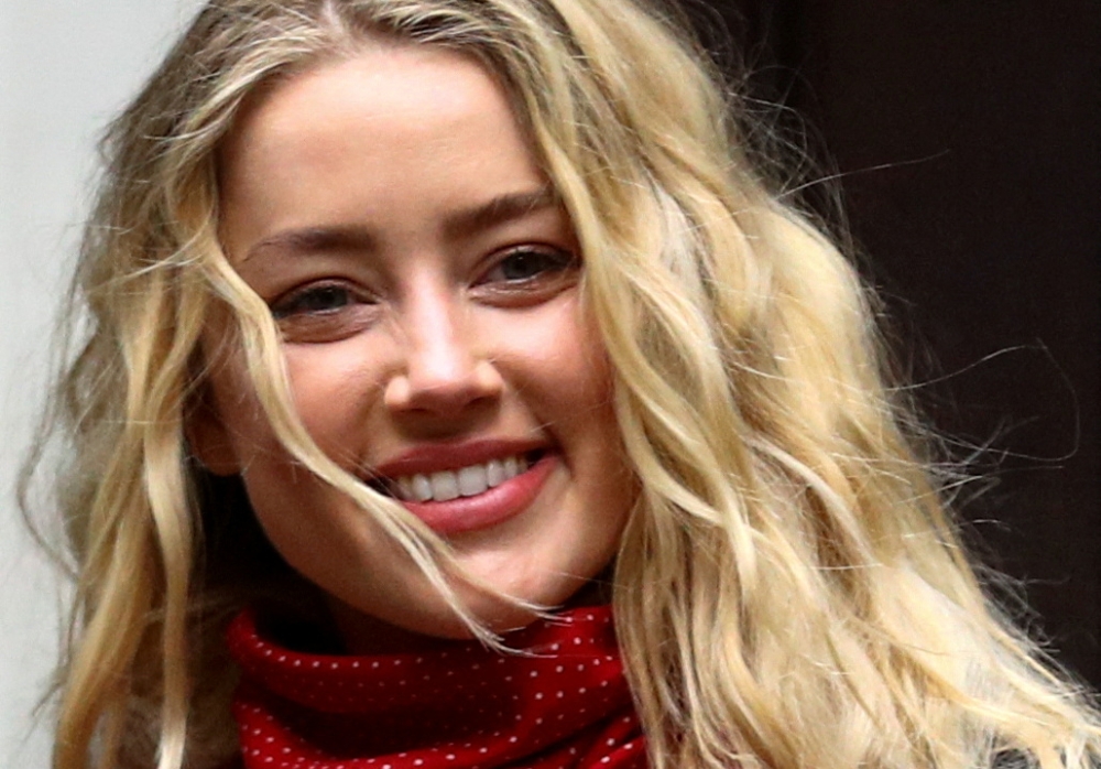 Actor Amber Heard reacts as she arrives at the High Court in London, Britain July 16, 2020. REUTERS/Hannah McKay/File Photo