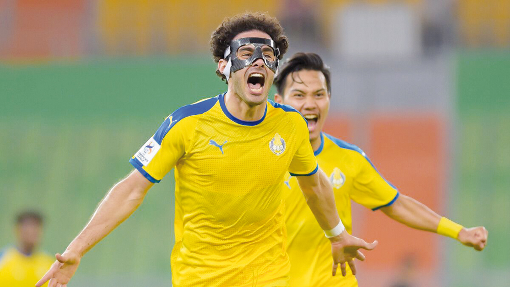 Ahmed Alaadin celebrates after scoring Al Gharafa's second goal against Ahal FC.
