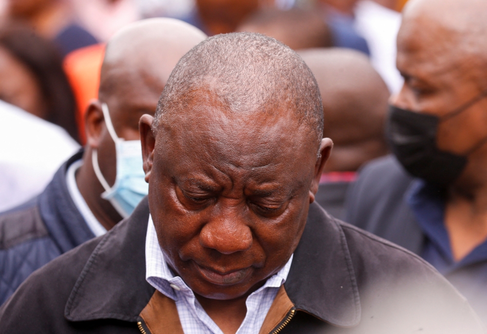 South African President Cyril Ramaphosa meets with people who lost family members during flooding in Clermont, Durban, South Africa, April 13, 2022. REUTERS/Rogan Ward