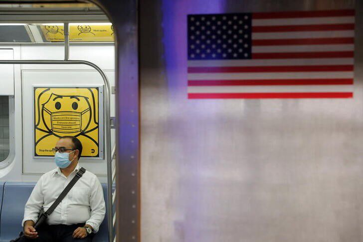File photo: A commuter wears a mask while riding the subway as cases of the infectious coronavirus Delta variant continue to rise in New York City, New York, U.S., July 26, 2021. REUTERS/Andrew Kelly



