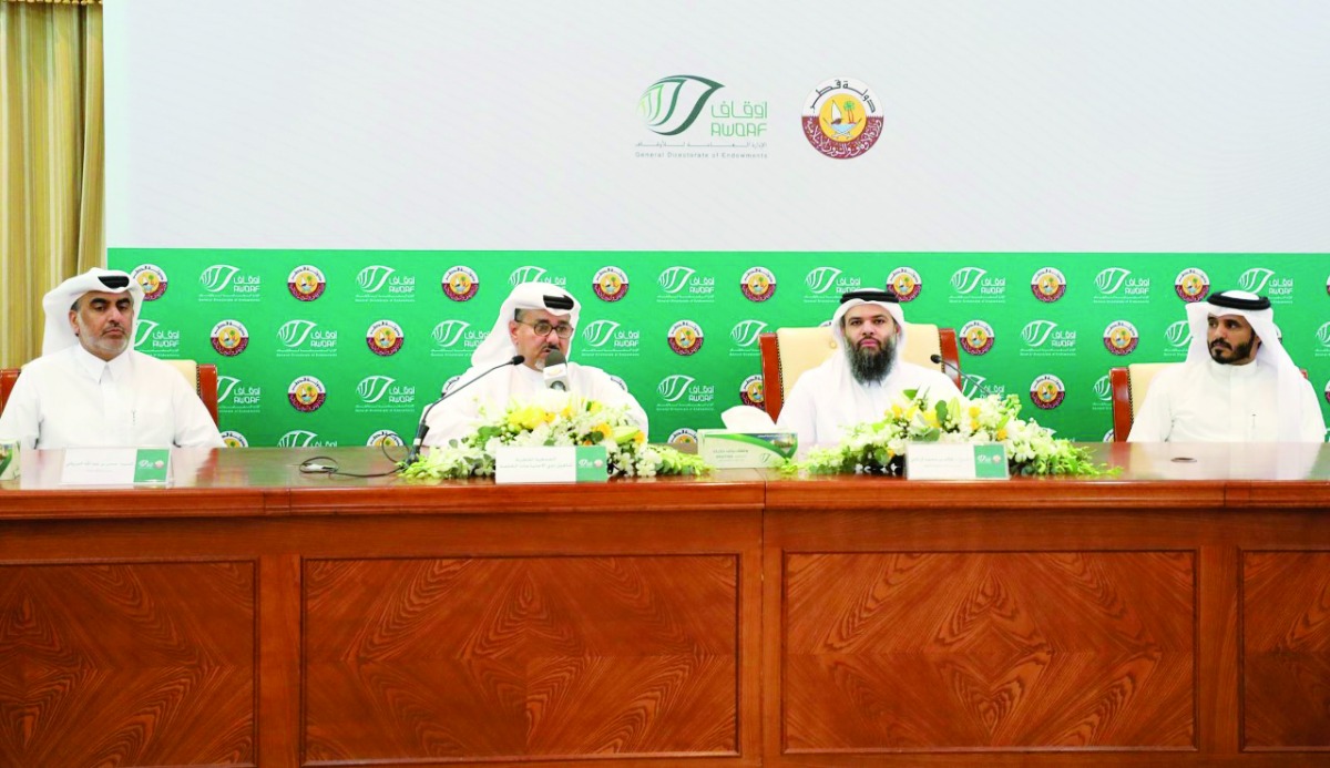 Director of General Department of Endowments, Dr. Sheikh Khalid bin Mohammed bin Ghanem Al Thani, and Member of the Board of Directors QSRN, Taleb Afifa, with other officials during a press conference.