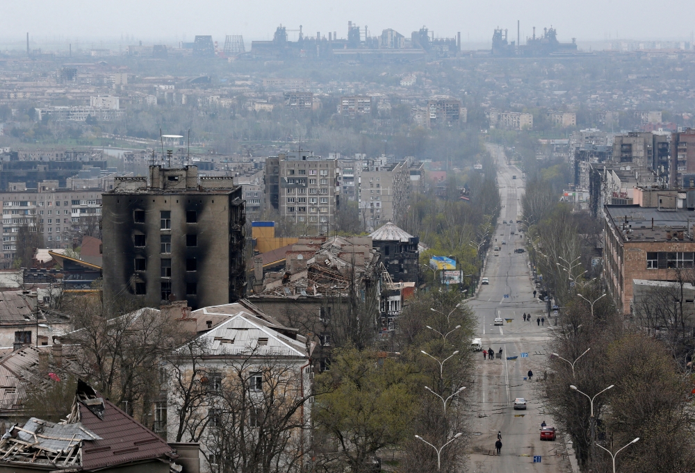 A view shows damaged buildings, with the Azovstal Iron and Steel Works plant in the background, in the southern port city of Mariupol, Ukraine April 19, 2022. REUTERS/Alexander Ermochenko/File Photo