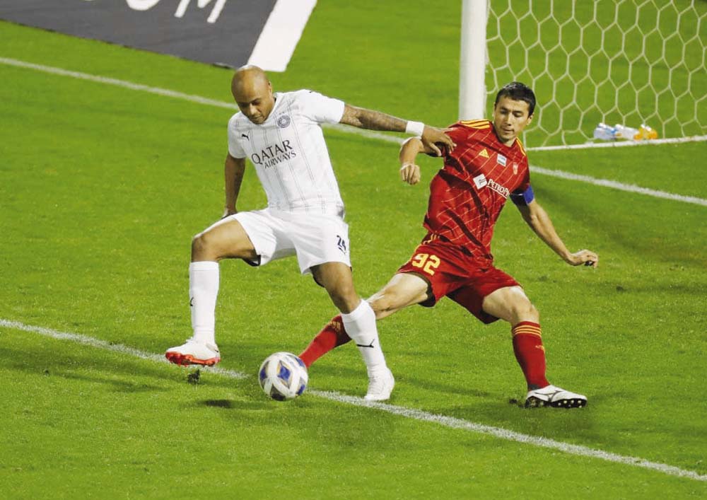 Al Sadd’s André Ayew (left) in action with FC Nasaf’s Umar Eshmurodov yesterday. 