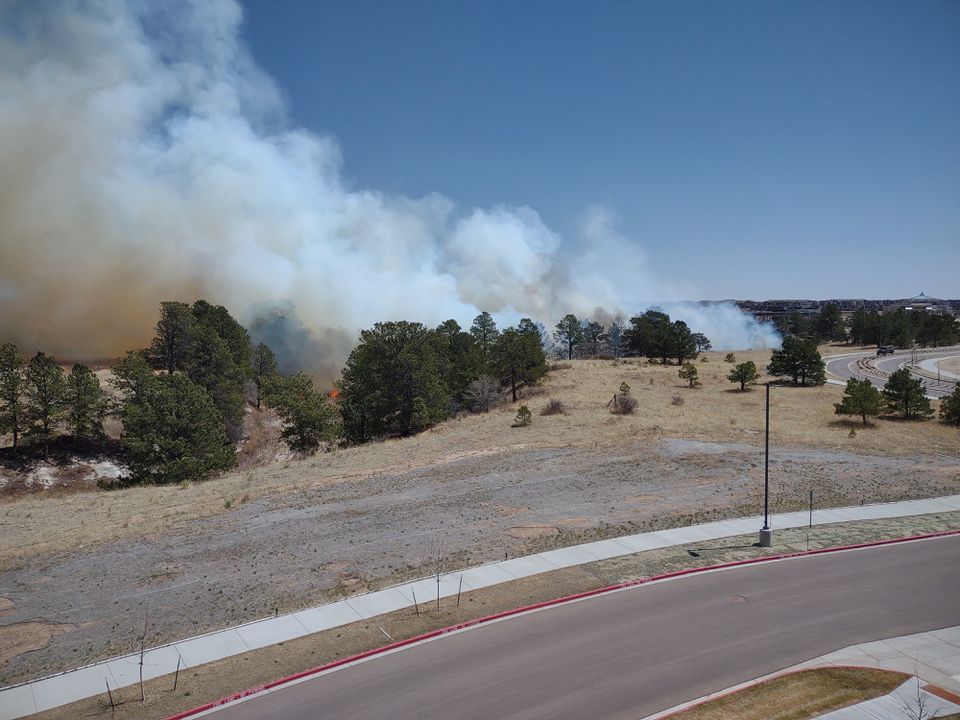 Smoke drifts from a fire in the neighbourhood of The Farm, in Colorado Springs, Colorado, U.S., April 22, 2022 in this image obtained from social media via REUTERS


