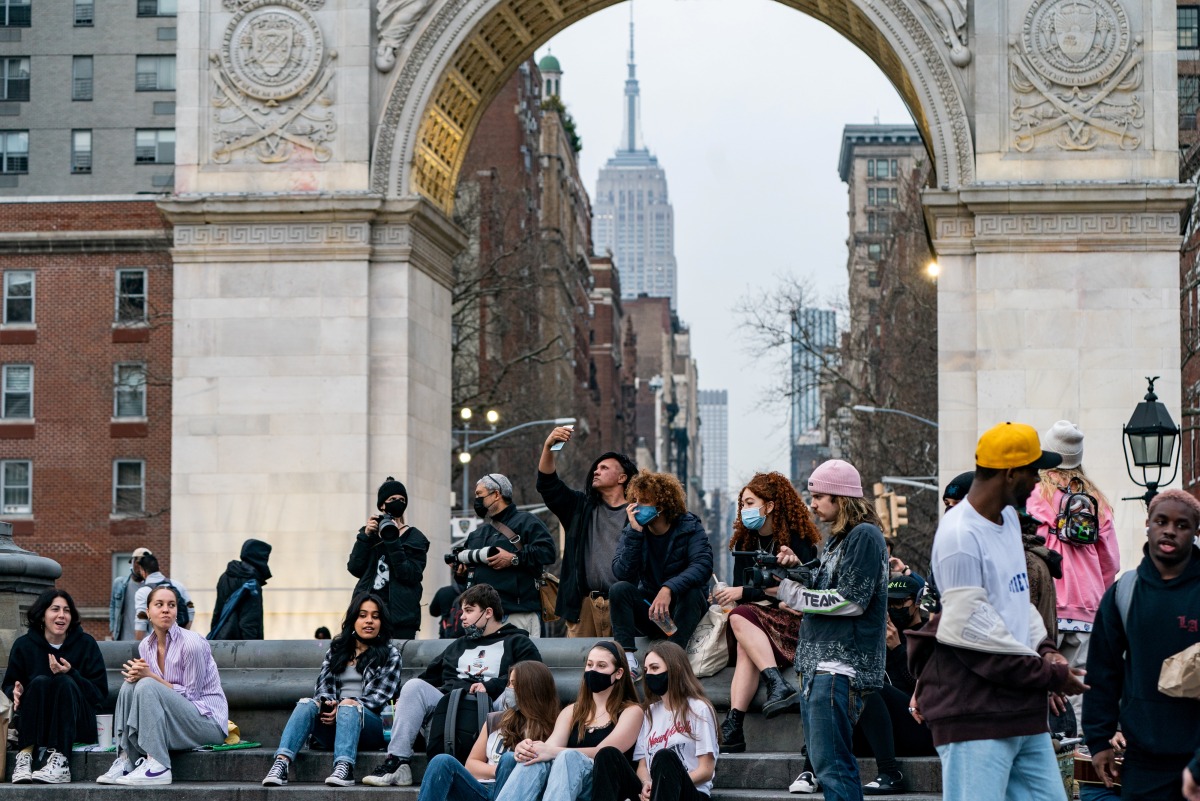 FILE PHOTO: People wearing protective masks are seen in Washington Square park during the outbreak of the coronavirus disease (COVID-19) in the Manhattan borough of New York City, New York, U.S., March 25, 2021. REUTERS/Jeenah Moon/File Photo


