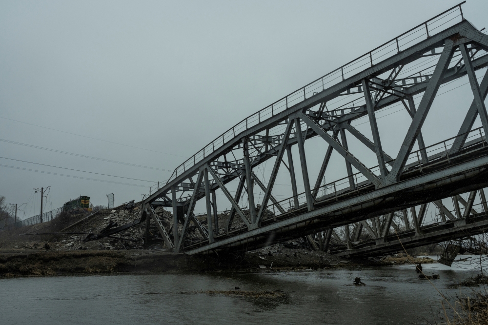 A view shows a railway bridge over the Irpin river destroyed by heavy shelling, as Russia's attack on Ukraine continues, in the town of Irpin, in Kyiv region, Ukraine March 29, 2022. Reuters/Serhii Mykhalchuk/File Photo
