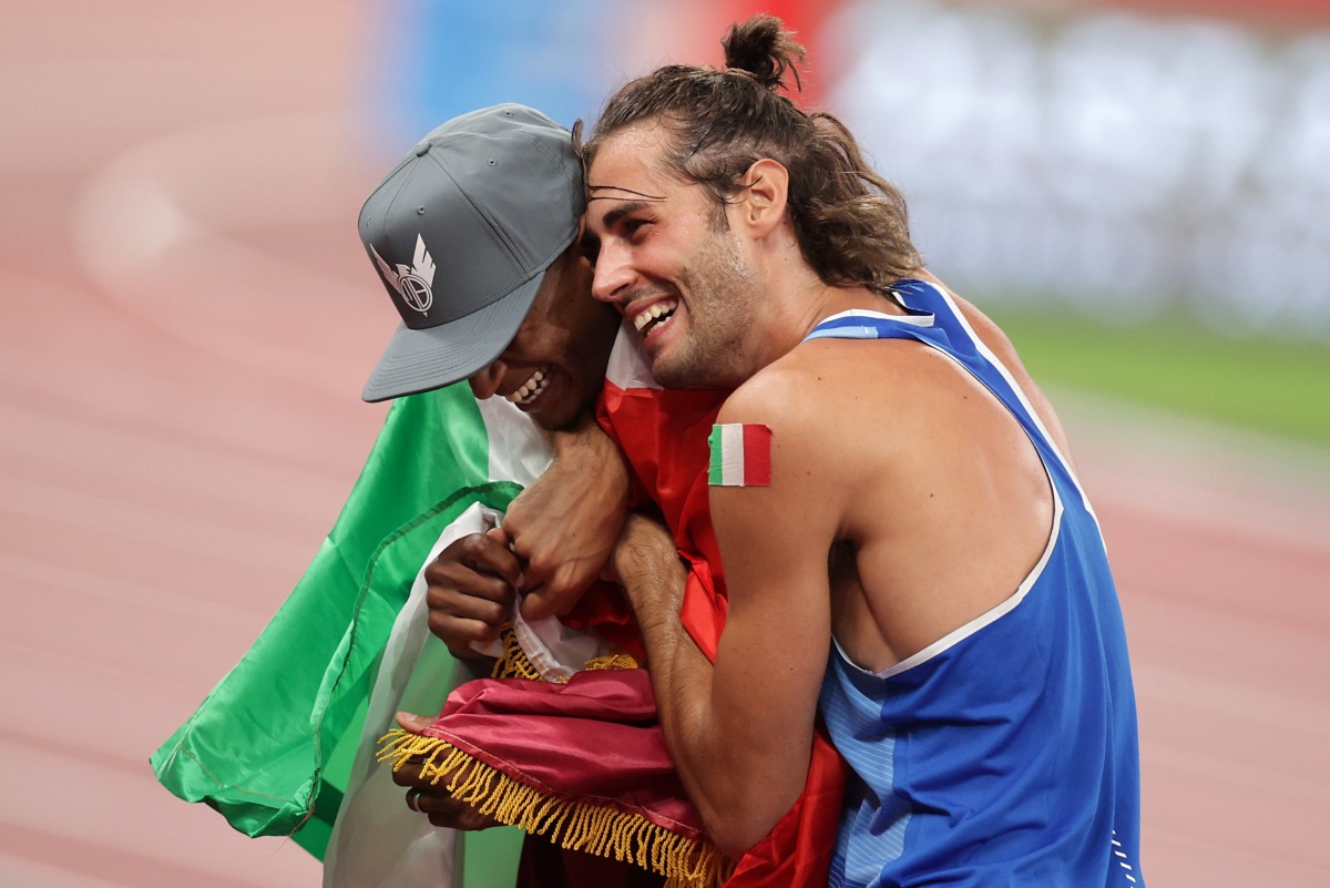 Qatar's Mutaz Essa Barshim and Gianmarco Tamberi of Italy celebrate after winning the gold medal during the Tokyo Olympics in this file photo.