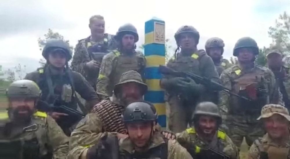 Ukrainian troops stand at the Ukraine-Russia border in what was said to be the Kharkiv region, Ukraine in this screen grab obtained from a video released on May 15, 2022. Ukrainian Ministry of Defence/Handout via REUTERS