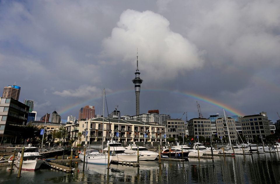 A rainbow appears on the Auckland skyline featuring Sky Tower in New Zealand, July 8, 2017. REUTERS/Jason Reed

