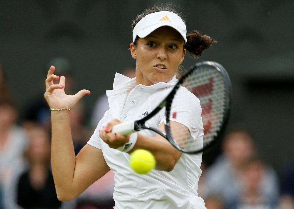 Laura Robson of Britain hits a return to Mariana Duque-Marino of Colombia during their women's singles tennis match at the Wimbledon Tennis Championships, in London June 28, 2013. REUTERS/Stefan Wermuth (BRITAIN - Tags: SPORT TENNIS)/File Photo