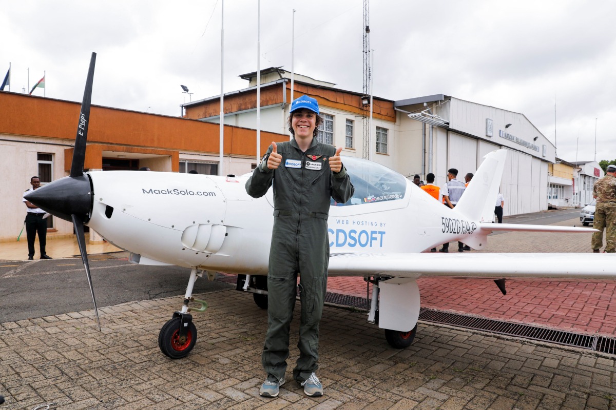 Mack Rutherford, a 16-year-old British-Belgian pilot, poses for a photo after arriving at the Wilson airport as part of a quest to become the youngest person to fly around the world solo, in Nairobi, Kenya, May 18, 2022. REUTERS/Baz Ratner
