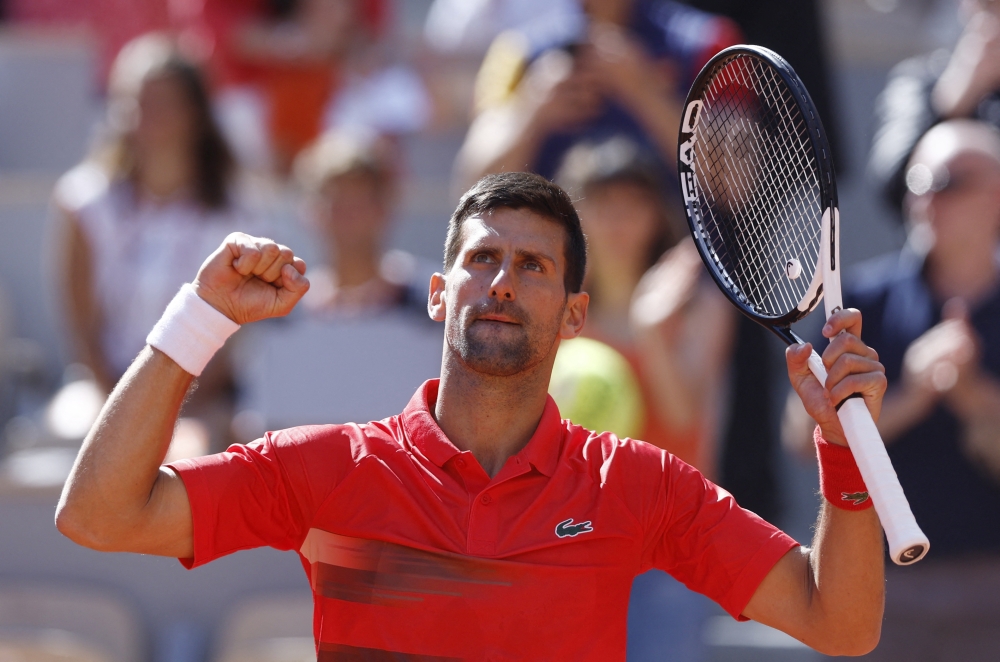 May 27, 2022 Serbia's Novak Djokovic celebrates winning his third round match against Slovenia's Aljaz Bedene REUTERS/Yves Herman