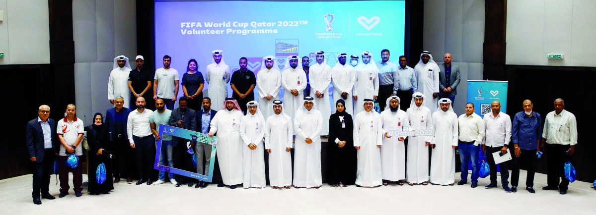 Qatar Olympic Committee (QOC) officials and participants of the volunteers promotional workshop pose for a photograph at the QOC Headquarters.