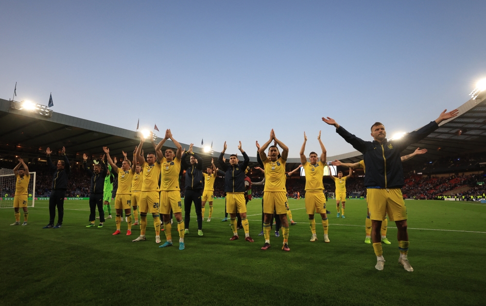 Ukraine players celebrate and applaud their fans after the match Action Images via Reuters/Lee Smith