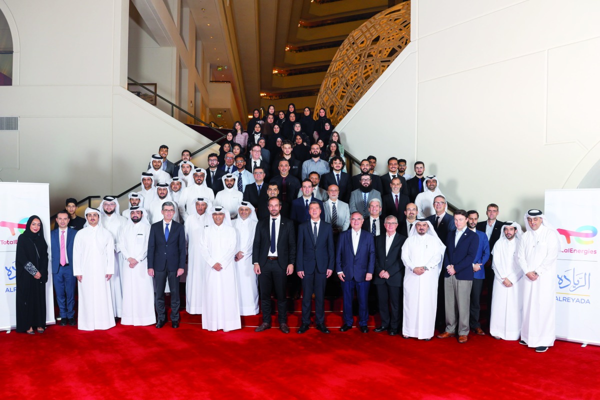 Matthieu Bouyer, Country Chair and Managing Director TotalEnergies EP Qatar with other officials and students pose for a group photo.