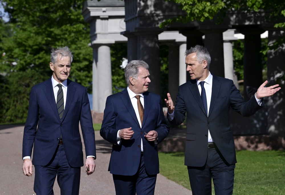 Norwegian PM Jonas Gahr Stoere, Finnish President Sauli Niinisto and NATO Secretary General Jens Stoltenberg arrive to the opening of the Kultaranta Talks in Naantali, Finland, June 12, 2022. Lehtikuva/Markku Ulander via Reuters 