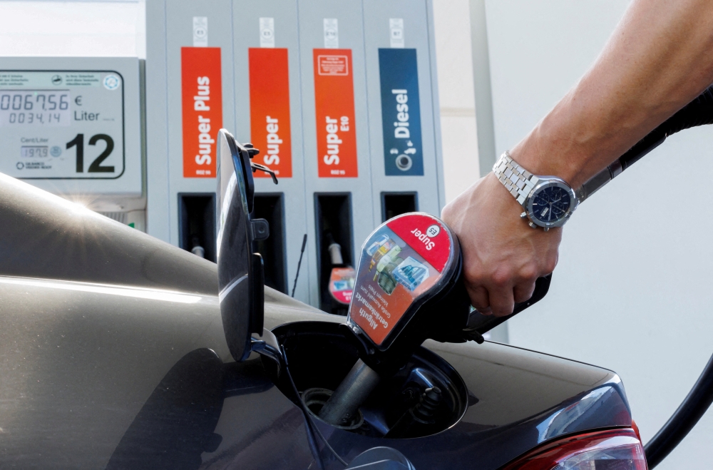 A motorist refuels his vehicle at an Allguth gas station in Munich, Germany, recently. (Reuters/Lukas Barth)