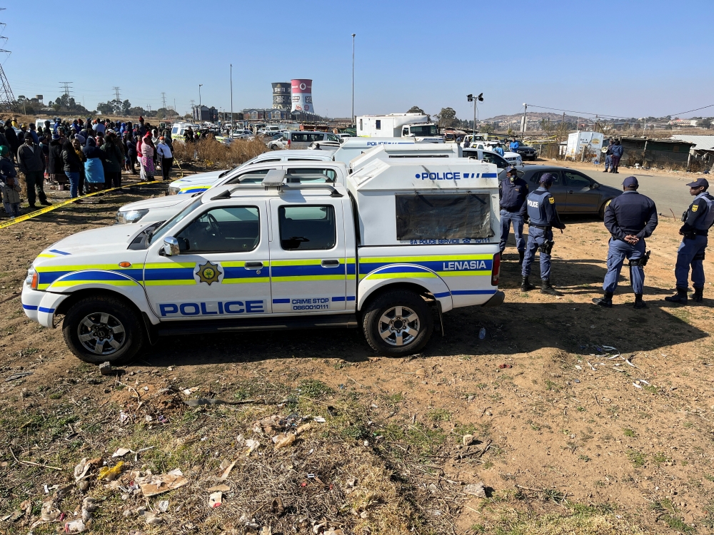 Police cordon off the scene where 15 people were killed by unknown gunmen inside a tavern, in Nomzamo, Soweto, Johannesburg, South Africa, July 10, 2022. (REUTERS/Siyabonga Sishi)